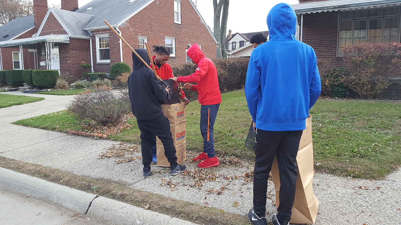 EHS students raking leaves near school